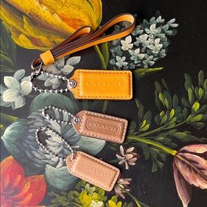 Coach Leather Keychain Trio in Orange, Brown, and Tan